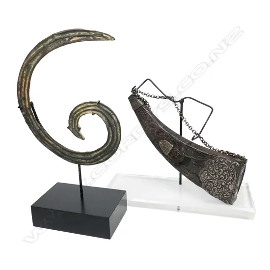 An old Indonesian carved horn container and old bronze tribal scroll section,